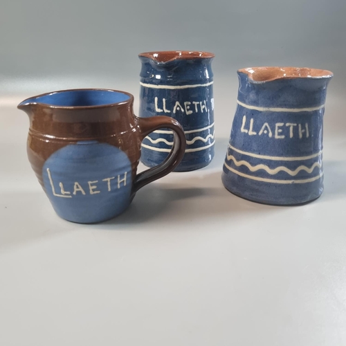 121 - Three Ewenny Pottery slip glazed 'Llaeth' jugs, two marked 'Clay Pits Ewenny' to the base.   (3)  (B... 