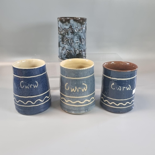 126 - Three Ewenny pottery slip glazed 'Cwrw' jugs, all marked 'Clay Pits Ewenny', together with another C... 