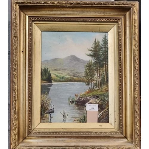 154 - W Faulkner (British early 20th century), Loch scene with Heron and mountains, signed.  Oils on board... 