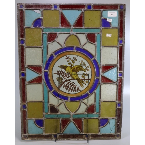 217 - Arts and Crafts design stained and leaded glass panel, the central circular panel decorated with a b... 