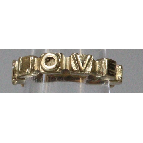 279 - 9ct gold ring marked 'Love God'.  Size K.  4.3g approx.  (B.P. 21% + VAT)