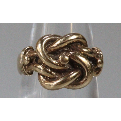 280 - Yellow metal knot design ring.  Size K1/2.  6.5g approx.  (B.P. 21% + VAT)