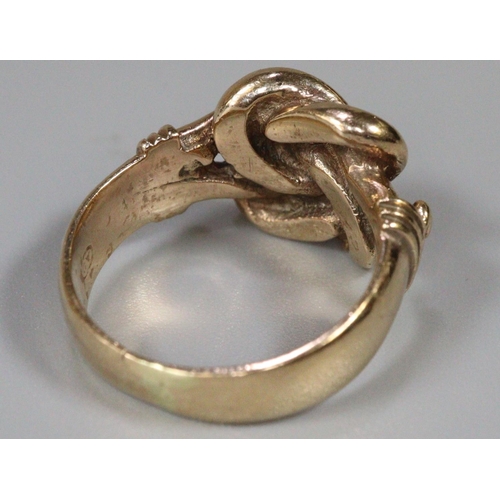 280 - Yellow metal knot design ring.  Size K1/2.  6.5g approx.  (B.P. 21% + VAT)