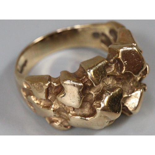 283 - 9ct gold modernist ring.  K1/2.  7.3g approx.  (B.P. 21% + VAT)