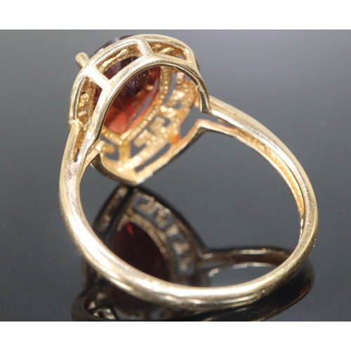 287 - 14ct gold coloured red pear shaped stone dress ring.  Size S.  3.9g approx.  (B.P. 21% + VAT)