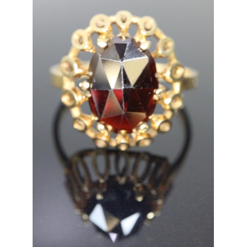 288 - 14ct gold red stone dress ring.  Size O.  3.5g approx.  (B.P. 21% + VAT)