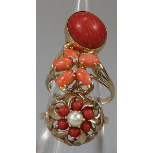 292 - Two 9ct gold and coral dress rings together with another yellow metal dress ring.  10g approx.  (3) ... 