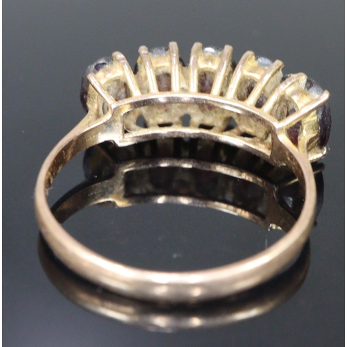 295 - 9ct gold five stone dress ring.  Size M1/2.  2.4g approx.  (B.P. 21% + VAT)