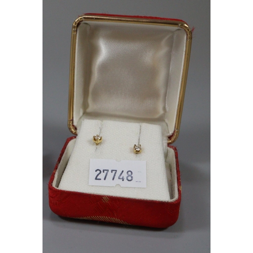 308 - Pair of gold and diamond earrings.  (B.P. 21% + VAT)