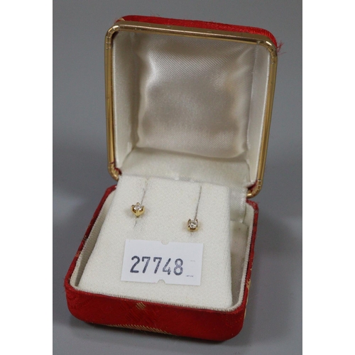 308 - Pair of gold and diamond earrings.  (B.P. 21% + VAT)