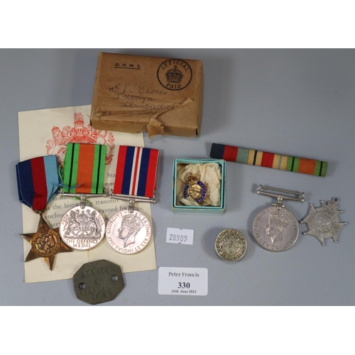 330 - A collection of militaria to include: boxed medals with ribbons (Defense Medal, War Medal 1939-45 an... 