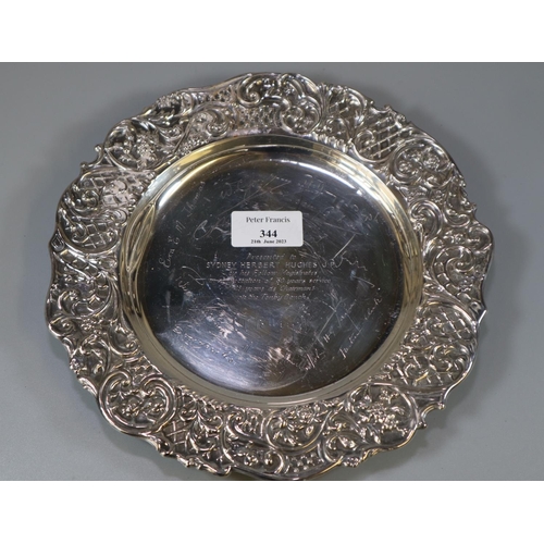 344 - Silver presentation shallow dish repoussé decorated with flowers, fruits and foliage presented to 'S... 