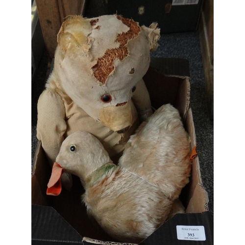 393 - Box containing two well loved antique soft toys; a duck with felt bill and glass eyes and a teddy be... 