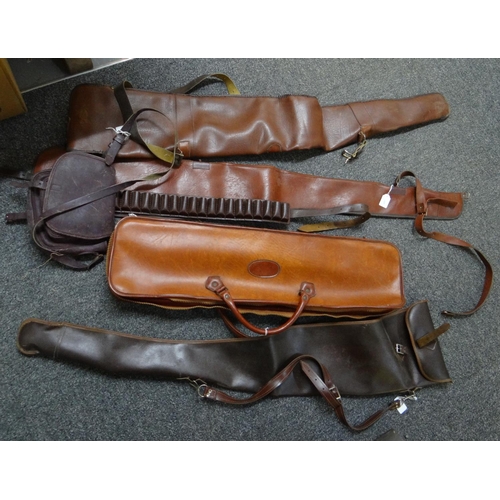 395 - Box containing four faux leather gun slips and cases, an ammunition belt and a leather bag. 
(B.P. 2... 