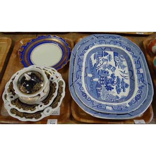 404 - Two trays of china to include: two blue and white willow pattern meat plates; one Staffordshire ston... 