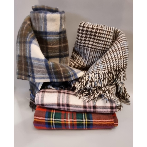 452 - Collection of four vintage woollen blankets, three check blankets, one check throw and a houndstooth... 