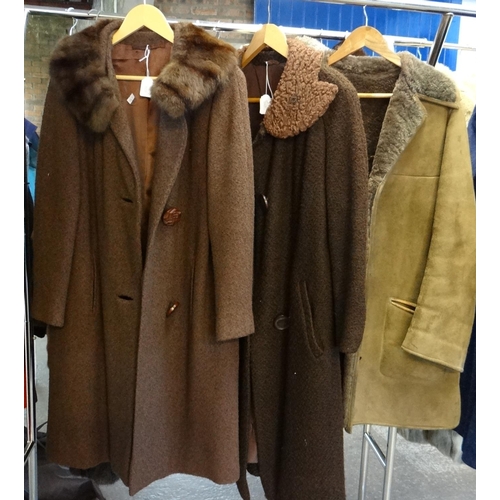 481 - Three vintage 60's-70's ladies coats to include: two brown woollen boucle swing coats with fur colla... 