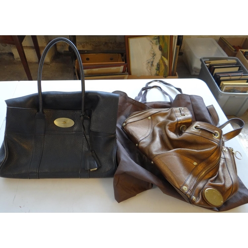 495 - Charity sale. Two leather ladies reproduction designer handbags with covering bag. (2)
(B.P. 21% + V... 