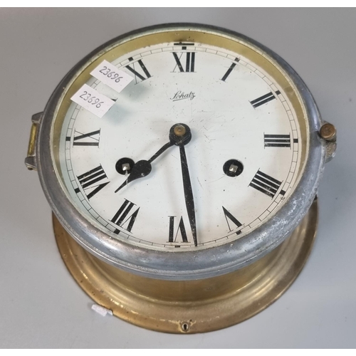 58 - Schatz brass two train bulkhead ship's clock.
(B.P. 21% + VAT)