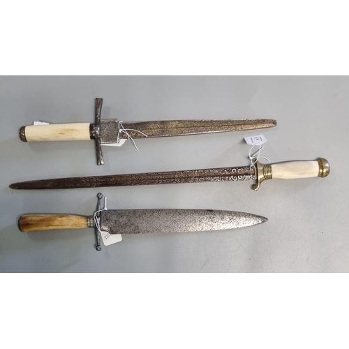 76 - Three 19th century daggers, one with heavily figured foliate decorated blade and brass mounted bone ... 