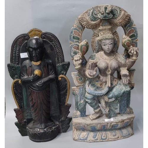 133 - Black stained and gilt highlighted carved wooden figure of Bodhisattva, standing on a lotus plinth, ... 