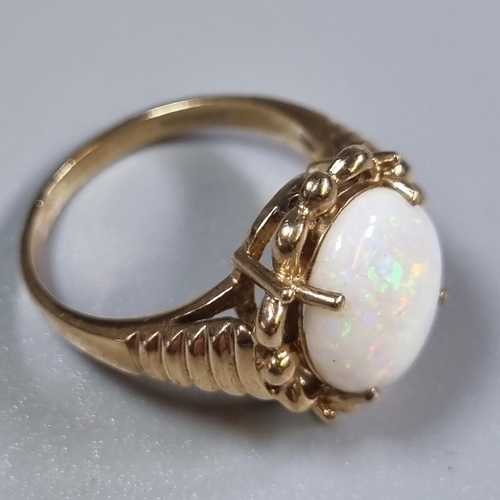 234 - Yellow metal and opal dress ring.  3.9g approx.  Size L.  (B.P. 21% + VAT)