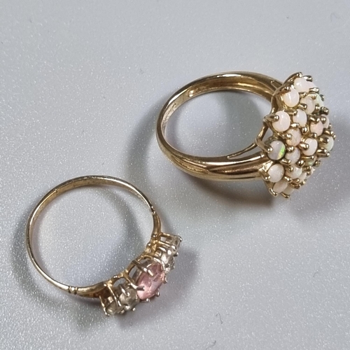 244 - 9ct gold cluster flower head design ring.  3.9g approx.  Size L.  Together with another 9ct gold whi... 