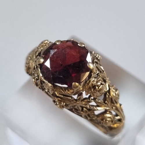 249 - 9ct gold and red stone facetted design dress ring.  5.4g approx.  Size T.  (B.P. 21% + VAT)