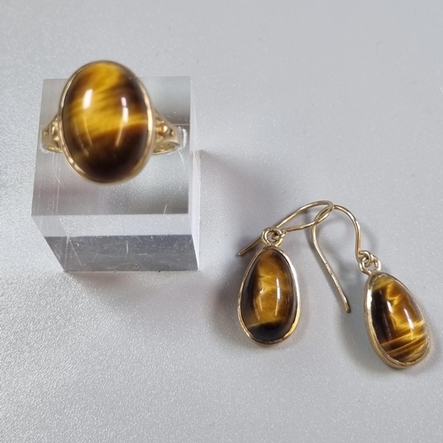 251 - 9ct gold tiger's eye dress ring.  4.9g approx.  Size S.  Together with a pair of matching 9ct gold p... 