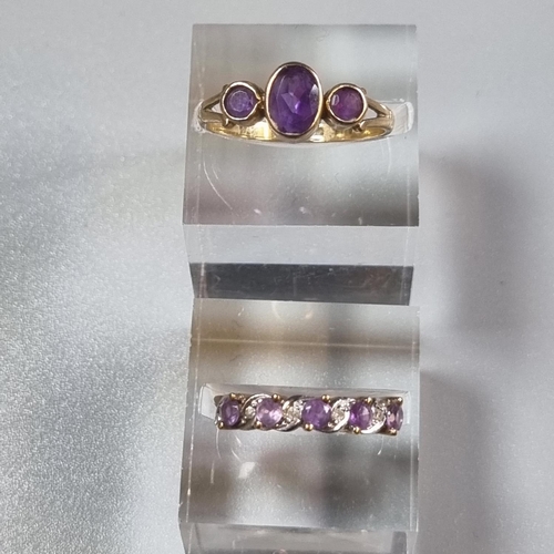 254 - Two 9ct gold purple stone dress rings.  4.2g approx. (2)  (B.P. 21% + VAT)