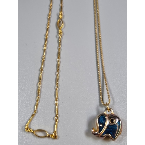 264 - Two yellow metal chains, one with elephant pendant.  (B.P. 21% + VAT)