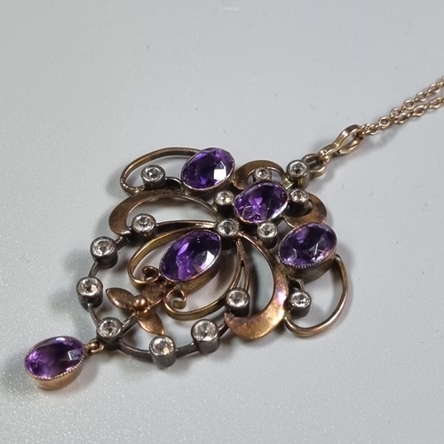 265 - Edwardian design yellow metal chain with Art Nouveau purple and white stone pendant.  (B.P. 21% + VA... 