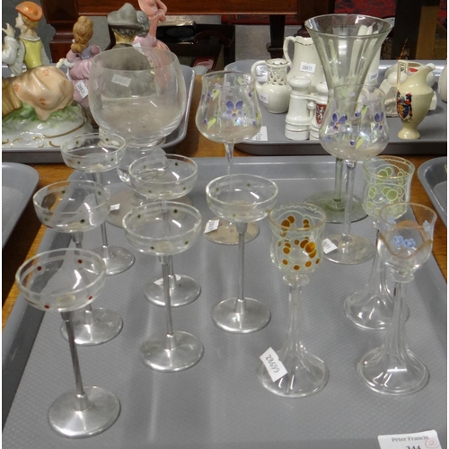 344 - Two trays of glassware to include: cranberry glass centre bowl, various Art Nouveau liqueur glasses ... 