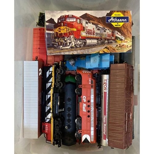 409 - Plastic box of assorted locomotives and tenders together with an Athearn Caboose Canadian National, ... 