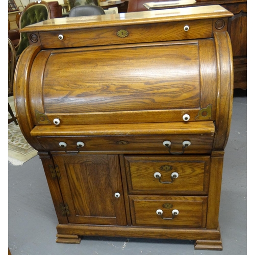 431 - 20th Century oak cylinder bureau with metal swan neck and ceramic handles.  (B.P. 21% + VAT)