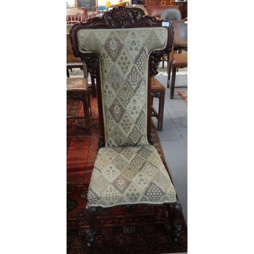 439 - Victorian walnut upholstered prie dieu chair on scroll legs and casters.  (B.P. 21% + VAT)