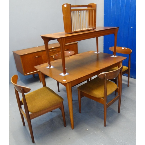 483 - Teak dining table with a set of four matching chairs, together with a similar coffee table and magaz... 