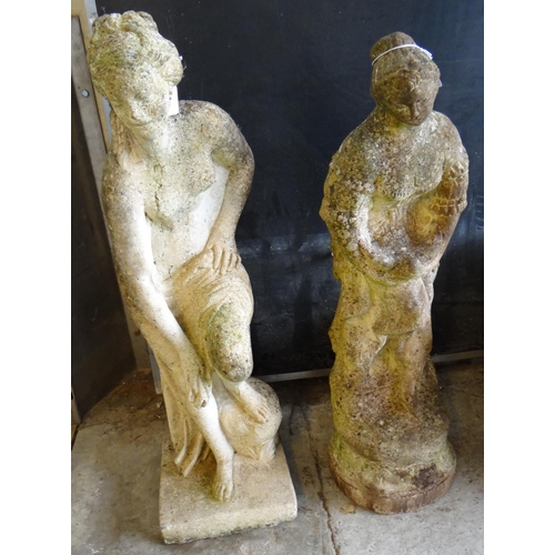 511 - Two similar composition garden ornaments in the form of semi nude ladies.  (2)  (B.P. 21% + VAT)