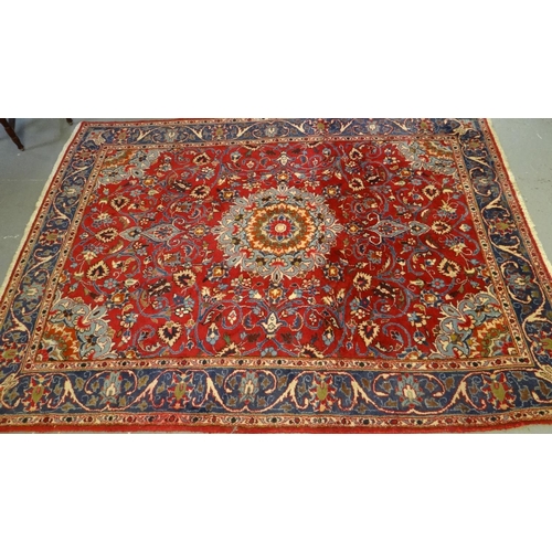 522 - Persian design red ground floral and foliate carpet.  (B.P. 21% + VAT)