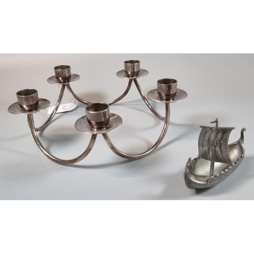 73A - A Berg of Denmark five branch silver plated candlestick, together with a pewter miniature model of a... 