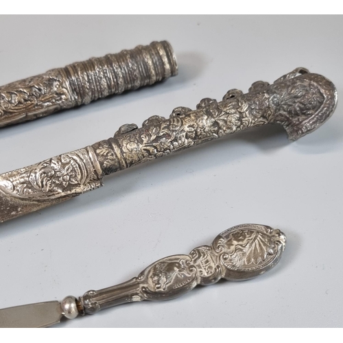 76 - White metal relief cast and chased Khandjar dagger of Middle Eastern origins, with steel blade. Over... 