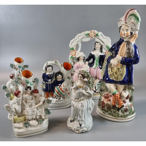 85 - A collection of 19th Century Staffordshire flat back figurines and figure group spill vases; includi... 