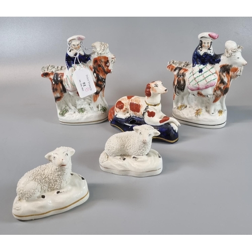 91 - Collection of Staffordshire pottery figures and animals to include: mirror matched pair of seated ri... 