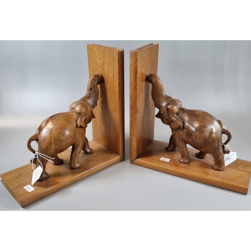 92 - Pair of hardwood bookends in the form of elephants. 
(B.P. 21% + VAT)