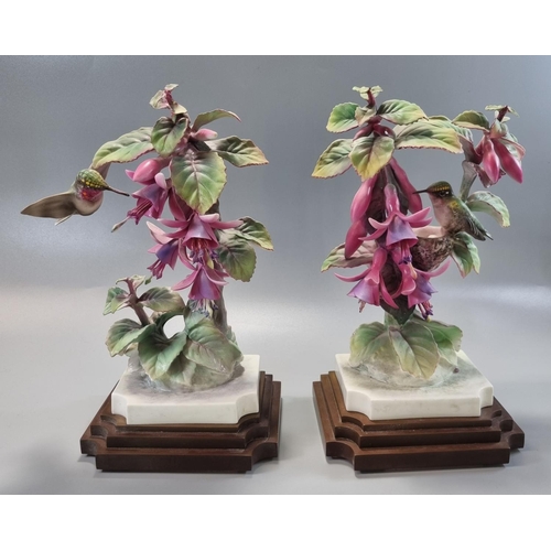 148 - Pair of Royal Worcester ruby throated humming bird figurines on composition Art Deco style stepped b... 