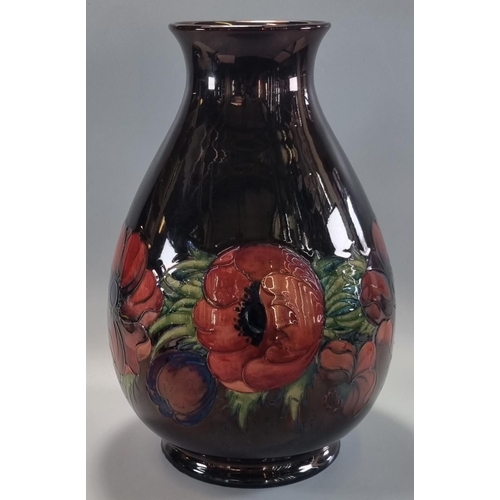 151 - Mid century Moorcroft pottery tube lined 'Anemone' vase, on a black ground, of baluster form, dated ... 