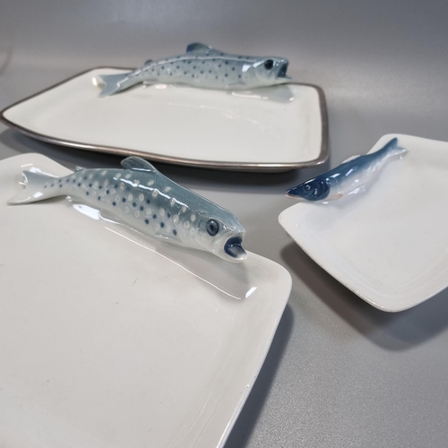 164 - Two similar German porcelain fish platters, one with white metal rim, both decorated with relief Tro... 