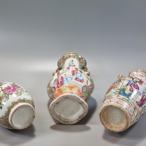 165 - Group of three Chinese porcelain Canton Famille Rose vases, ranging in height from 14.5cm to 23.5cm,... 