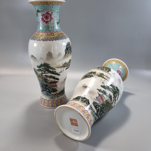 166 - Pair of Chinese mirror matched porcelain Famille Rose baluster 'Landscape Vases', each depicting a p... 