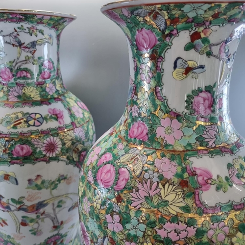 168 - Pair of large Chinese Canton style Famille Rose baluster vases decorated with panels of birds, butte... 